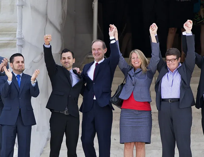 Plaintiffs in Hollingsworth v. Perry, the California Proposition 8 case, celebrate on the steps of the Supreme Court on June 26, 2013. (from l) Jeffrey Zarrillo and his partner Paul Katami, attorney David Boies, and Sandra Stier and her partner Kris Perry – Photo by J. Scott Applewhite / AP